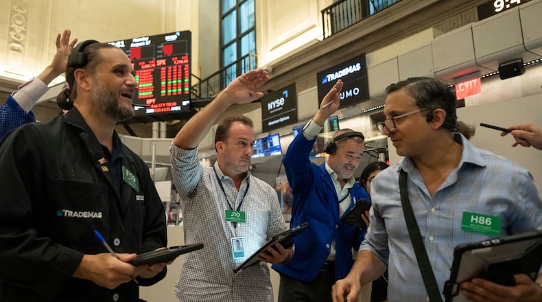 Options traders Chris Dattolo, Scott Frinzi, Justin Kanda, and Ravi Bhandari, left to right, work on the floor of the New York Stock Exchange, Monday, Aug. 17, 2026, in New York. (AP Photo/Yuki Iwamura)