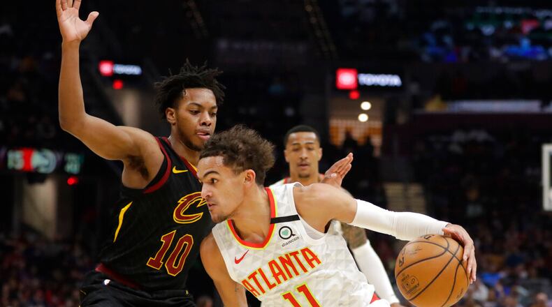 Atlanta Hawks' Trae Young (11) drives past Cleveland Cavaliers' Darius Garland (10) in the second half of an NBA basketball game, Wednesday, Feb. 12, 2020, in Cleveland. The Cavaliers won 127-105. (AP Photo/Tony Dejak)
