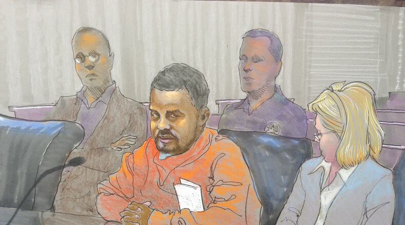 A sketch of Wildrego Jackson in federal court next to his attorney Millie Dunn on Thursday, Sept. 26, 2013. A judge ordered him held without bond. He's charged in connection to the kidnapping of 14-year old Ayvani Perez.