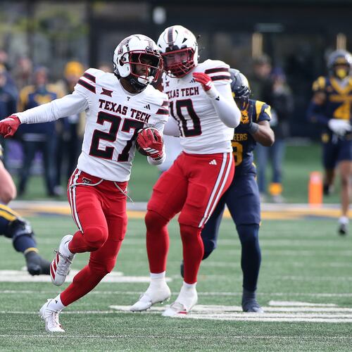 Texas Tech cornerback Amier Boyd (27) intercepts the ball against West Virginia during the second half of an NCAA college football game Saturday, Nov. 29, 2025, in Morgantown, W.Va. (AP Photo/Kathleen Batten)