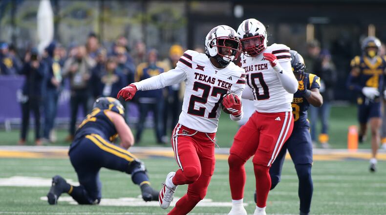Texas Tech cornerback Amier Boyd (27) intercepts the ball against West Virginia during the second half of an NCAA college football game Saturday, Nov. 29, 2025, in Morgantown, W.Va. (AP Photo/Kathleen Batten)