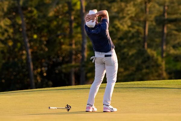 Rory McIlroy, of Northern Ireland, celebrates winning in a playoff against Justin Rose, of England, after the final round the Masters golf tournament, Sunday, April 13, 2025, in Augusta, Ga. (AP Photo/David J. Phillip)