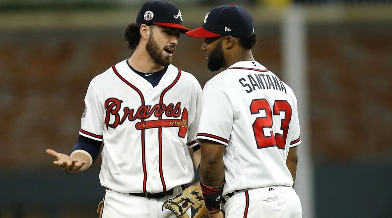 Shortstop Dansby Swanson talks to second baseman Danny Santana after the game against the San Francisco Giants at SunTrust Park on June 22, 2017 in Atlanta.