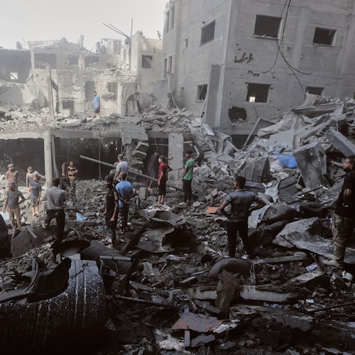 Palestinians inspect the rubble of a building, destroyed by an Israeli army strike at Al-Shati camp in Gaza City Wednesday, Oct. 29, 2025. (AP Photo/Yousef Al Zanoun)