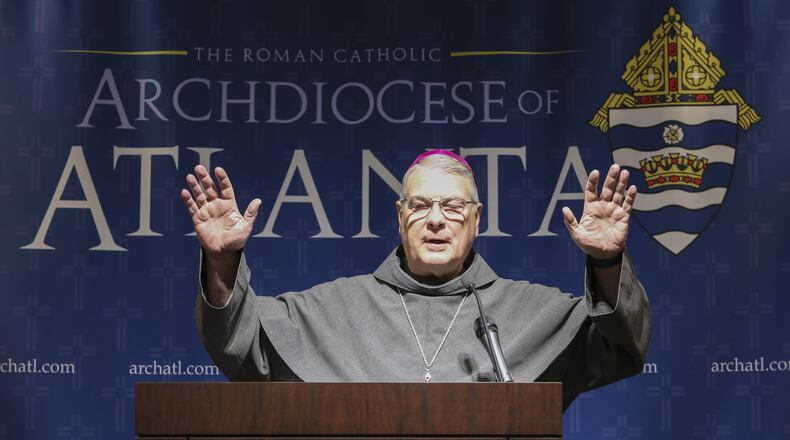 Archbishop Gregory John Hartmayer extends a Franciscan blessing to all in attendance at the end of his March 5 press conference. Pope Francis named Hartmayer the seventh archbishop for the Archdiocese of Atlanta. CONTRIBUTED BY MICHAEL ALEXANDER