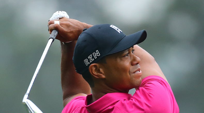 Tiger Woods tees off on the fourth hole during his practice round for the Masters at Augusta National Golf Club on Tuesday, April 7, 2015, in Augusta. Curtis Compton / ccompton@ajc.com