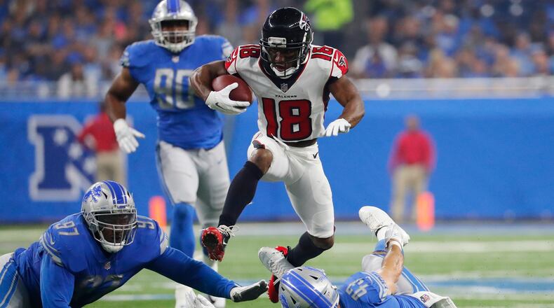 Atlanta Falcons wide receiver Taylor Gabriel (18) leaps over Detroit Lions linebacker Nick Bellore (43) during the first half of an NFL football game, Sunday, Sept. 24, 2017, in Detroit. (AP Photo/Rick Osentoski)