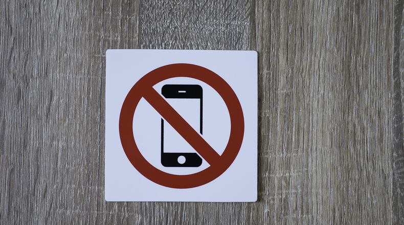 Both chambers of the Georgia Legislature have passed a bill that would prohibit the use of cellphones and other devices in public elementary and middle schools. (Dreamstime/TNS)