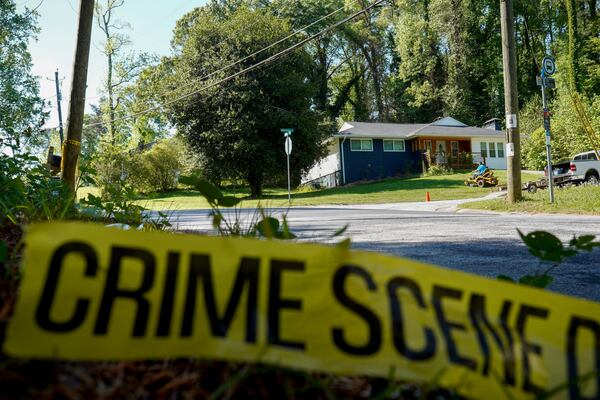 One of the three incidents on Monday happened on Battle Forest Drive in DeKalb County. On Tuesday, the police tape remained. (Ben Hendren for the AJC)