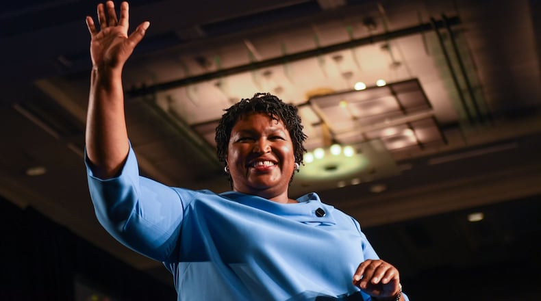 Democratic Georgia gubernatorial candidate Stacey Abrams addresses the crowd in the early morning hours on Nov. 7, 2018, at the Hyatt Regency Hotel in downtown Atlanta. She told supporters votes still needed to be counted and of the chance of a runoff election. (ALYSSA POINTER/ALYSSA.POINTER@AJC.COM)