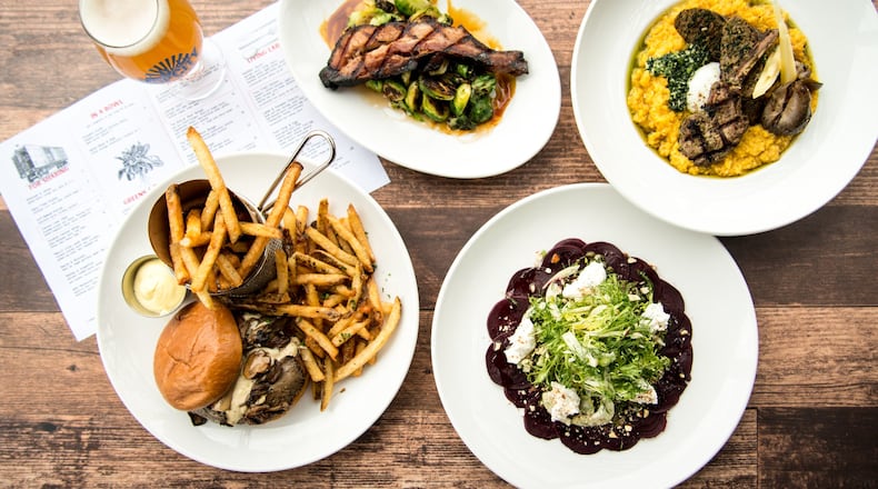 BoxCar (clockwise from bottom left) The Big Bleu Bison Burger, Bacon and Brussels, Lamb and Pumpkin Polenta, and Roasted Beet Carpaccio. Photo credit- Mia Yakel.