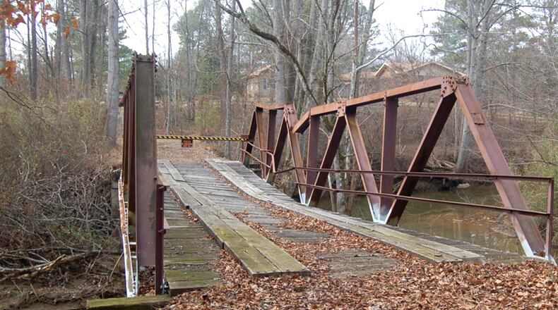 Garland Mountain Way crosses Salacoa Creek in rural northwest Cherokee County. The county is moving to abandon a portion of the road that has been closed to the public for at least two decades. CHEROKEE COUNTY