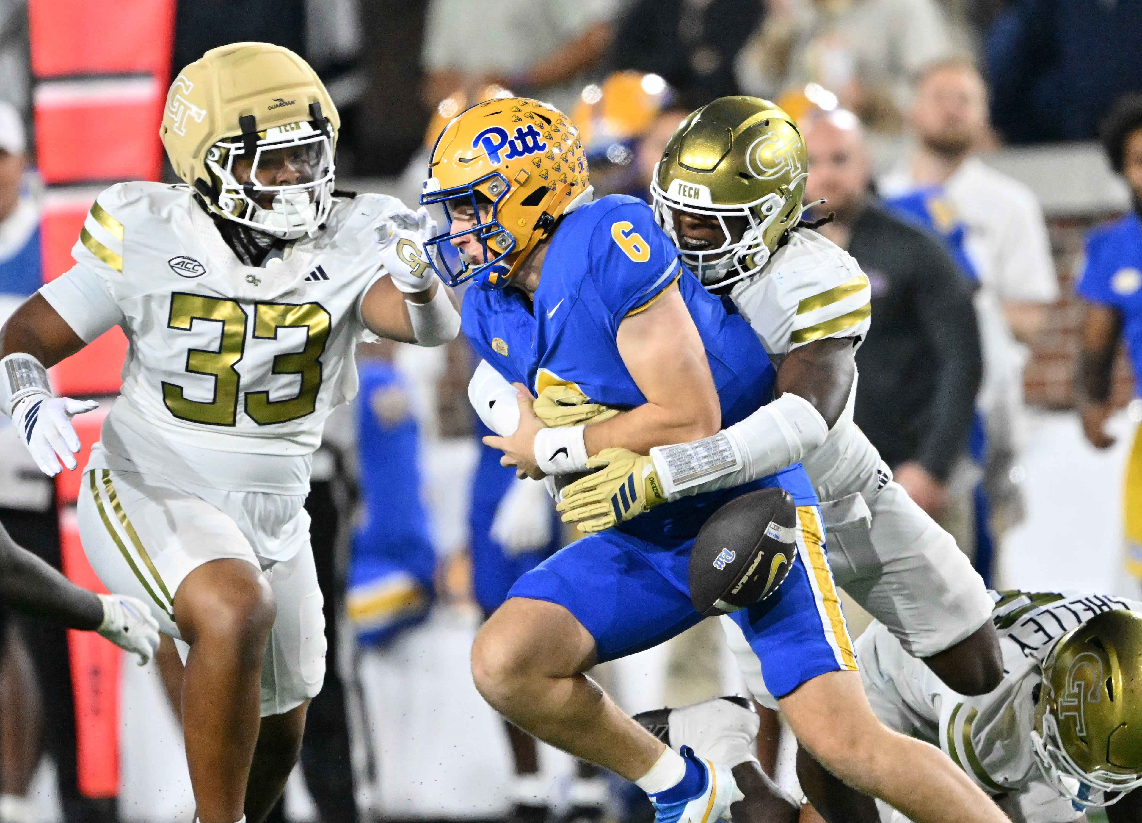 Pittsburgh quarterback Mason Heintschel (6) is sacked by Georgia Tech linebacker Cayman Spaulding (1) during the first half in an NCAA college football game at Bobby Dodd Stadium, Saturday, November 22, 2025 in Atlanta. (Hyosub Shin / AJC)