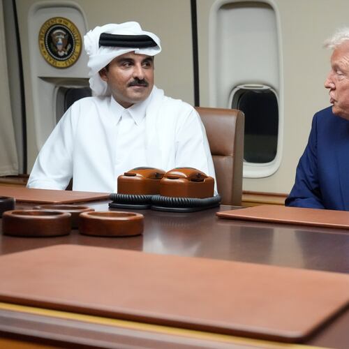 FILE - President Donald Trump, right, meets with Emir of Qatar Sheikh Tamim bin Hamad al-Thani aboard Air Force One at Al Udeid Air Base in Doha, Qatar, Saturday, Oct. 25, 2025. (AP Photo/Mark Schiefelbein, File)