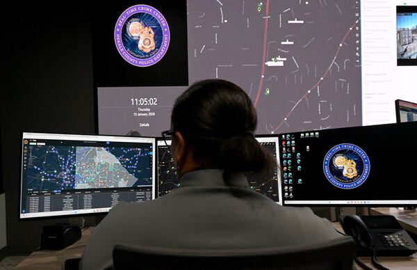 An analyst monitors camera feeds at the Real Time Crime Center inside DeKalb County Police Department Headquarters.