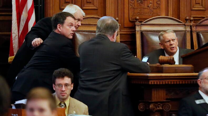 2/28/19 - Atlanta - Majority Leader Jon Burns (from left), R - Newington, Minority Leader Robert Trammell, D - Luthersville, Appropriations Chairman Terry England, R - Auburn, and House Speaker David Ralston confer before the House took a recess before taking up the state budget. Bob Andres / bandres@ajc.com