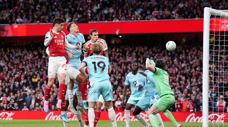 Arsenal's Kai Havertz, left, scores their side's first goal during the English Premier League soccer match between Arsenal and Burnley in London, Monday May 18, 2026. (John Walton/PA via AP)