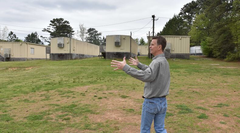 A construction worker watches over the operation at the construction of Brumby Elementary School in Marietta, Georgia, on March 10, 2017. Cobb County residents will soon vote whether to extend its education SPLOST for another five years.(HENRY TAYLOR / HENRY.TAYLOR@AJC.COM)