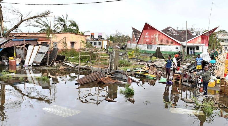 People survey the damage done by cyclone Gezina in Toamasina, Madagascar, Wednesday, Feb. 11, 2026. (AP Photo/Hery Nirina Rabary)