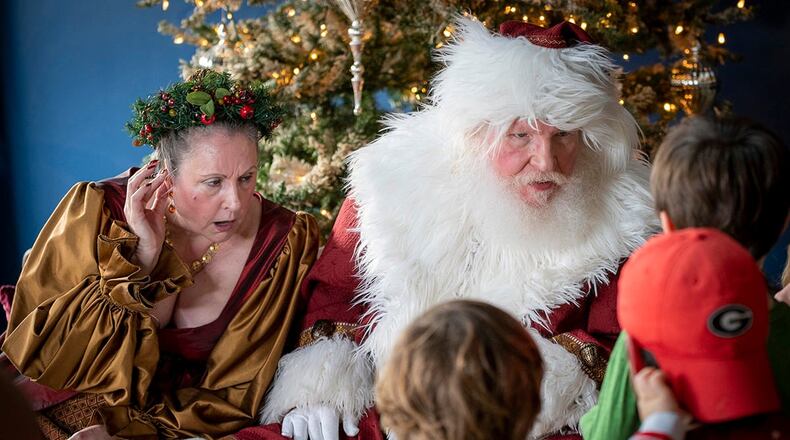 The first Town Green Lighting will take place at 6 p.m. Nov. 28 in Avondale Estates. Here Santa and Mrs. Claus greet children during Winter Wanderland that is scheduled for noon to 5 p.m. Dec. 10 at participating businesses in the city. (Courtesy of Explore Avondale)