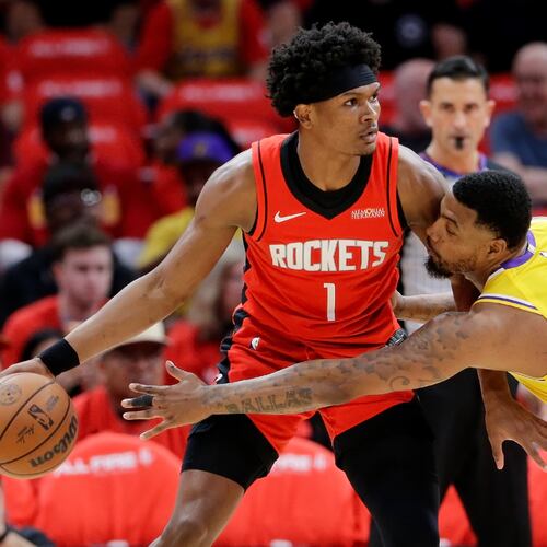 Houston Rockets guard Amen Thompson (1) looks to drive around Los Angeles Lakers guard Marcus Smart (36) who reaches in during the first half of Game 3 in a first-round NBA playoffs basketball series Friday April 24, 2026, in Houston. (AP Photo/Michael Wyke)
