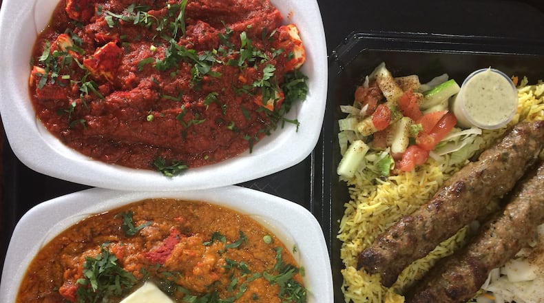 Kabab Express excels at “Indo-Pak” seekh kebabs like lamb (right), as well as other South Asian classics like paneer tava (cheese in spicy red chili sauce, upper left) and Butter Chicken Gravy (lower left). CONTRIBUTED BY WENDELL BROCK