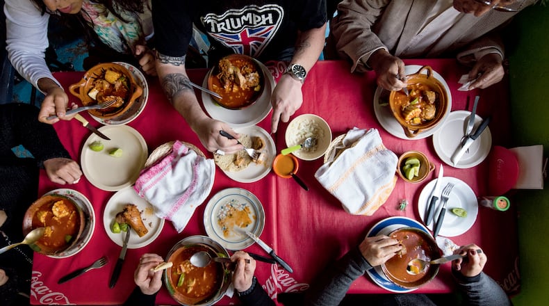 Enjoying soups and stews, such as this mole de olla being eaten at a fonda, is a Mexico City pastime. Courtesy of Ten Speed Press/James Roper © 2020