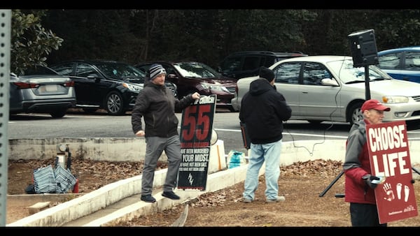Protesters outside the Feminist Center for Reproductive Liberation are a perpetual audio and visual presence during "The Devil is Busy," an Oscar-nominated documentary available on HBO Max. (Courtesy of HBO Max)