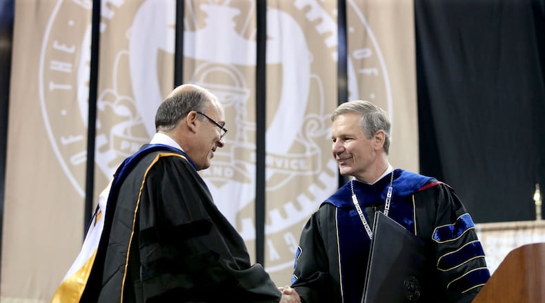 Muhtar Kent, Chairman of the Board of The Coca-Cola Company, (left) greets Georgia Tech President Bud Peterson before Kent’s speech during the Georgia Tech Bachelor’s morning ceremony of Spring 2014 Commencement at the McCamish Pavilion Saturday morning May 3, 2014 in Atlanta, Ga. (Photo/Jason Getz)