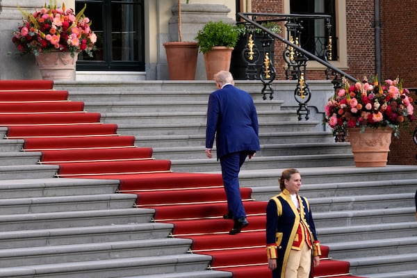 President Donald Trump climbs the stairs to the Paleis Huis ten Bosch ahead of the NATO summit in The Hague, Netherlands, Tuesday, June 24, 2025. (AP Photo/Alex Brandon)