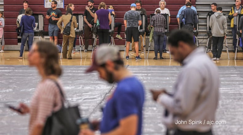 <p>Voters wait in line at Anniston Elementary in Gwinnett County on Election Day 2018.</p> <p>Voters in line at Grady</p>