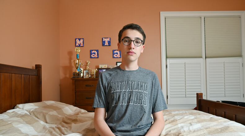 Matan Berg, 16, a sophomore at North Atlanta High School, started a petition urging Atlanta Public Schools to roll back plans to start the high school day earlier next year. He is pictured at his Atlanta home on Tuesday, May 11, 2021. (Hyosub Shin / Hyosub.Shin@ajc.com)