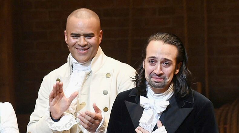 FILE - Lin-Manuel Miranda, right, takes his final performance curtain call with cast member Christopher Jackson after a performance of "Hamilton" in New York on July 9, 2016. (Photo by Evan Agostini/Invision/AP, File)