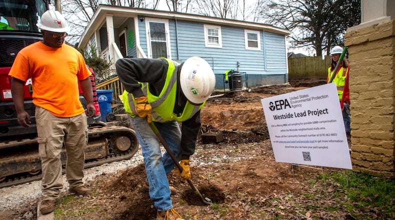 Workers remove polluted soil from the Westside Lead Superfund Site in Atlanta on Wednesday, Feb. 2, 2022. (Steve Schaefer for the AJC)