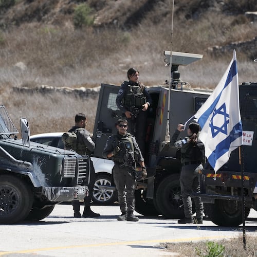 Members of the Israeli forces stand guard near the site of a shooting attack that, according to Israeli officials, killed one Israeli near the settlement of Neve Tzuf, north of the West Bank city of Ramallah, Sunday, Sept. 20, 2026. (AP Photo/Mahmoud Illean)