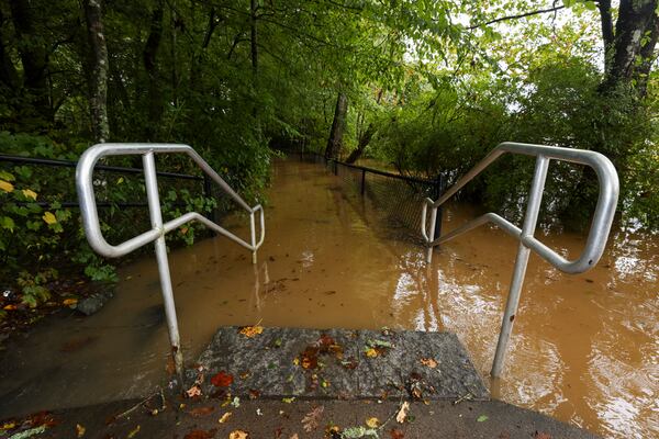 High water floods the bank of the Chattahoochee River at Jones Bridge Park on Friday, Sept. 27, 2024, in Peachtree Corners. Hurricane Helene brought heavy rain and high winds across Georgia. (Jason Getz/AJC 2024)


