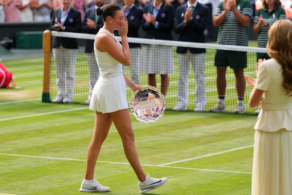 Amanda Anisimova of the U.S. reacts after losing the women's singles final match against Iga Swiatek of Poland at the Wimbledon Tennis Championships in London, Saturday, July 12, 2025.(AP Photo/Kirsty Wigglesworth)