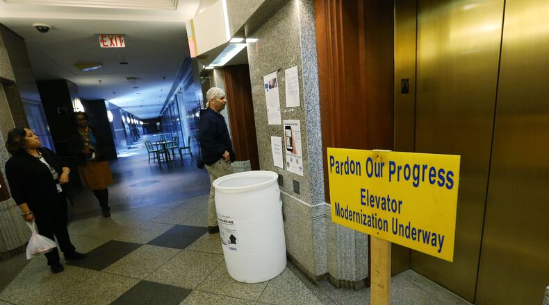 In the Fulton County Government Center, portable heaters sit in the atrium, and signs inform of renovations that are in progress, including the elevators. Fulton County is set to spend nearly half a million dollars to assess its facilities. Some renovations are in progress. BOB ANDRES / BANDRES@AJC.COM AJC File Photo