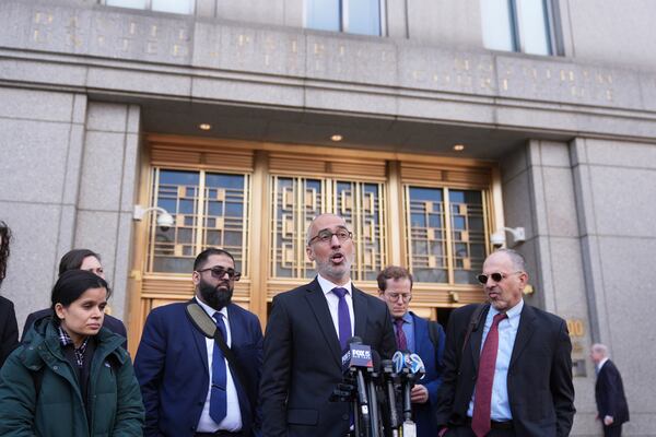 Ramzi Kassem, third from right, a lawyer representing Yunseo Chung, talks to reporters outside a federal courthouse in New York, Tuesday, March 25, 2025. (AP Photo/Seth Wenig)