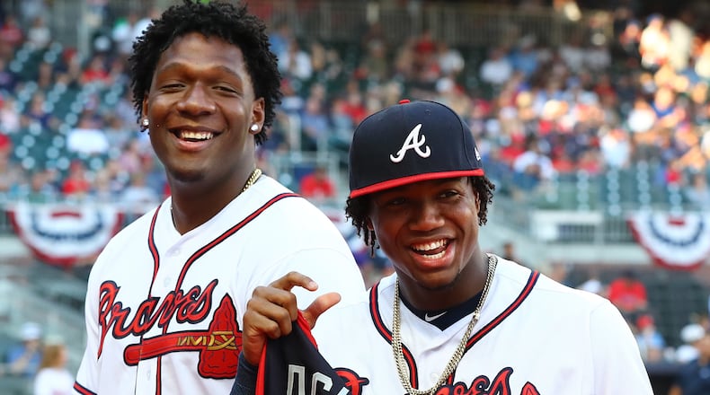 Ronald Acuna is presented his All-Star jersey by his brother Luisangel Acuna last year.  Curtis Compton/ccompton@ajc.com