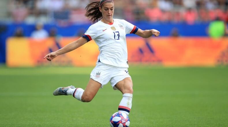 REIMS, FRANCE - Alex Morgan of USA advances the ball at the 2019 FIFA Women's World Cup France Round Of 16 match.