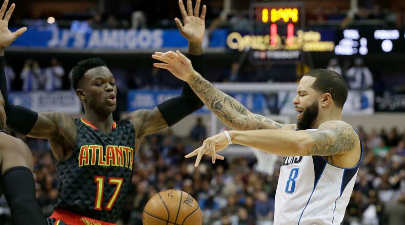 Atlanta Hawks defender Dennis Schroder (17) makes Dallas Mavericks guard Deron Williams (8) lose control of the ball during the first half of an NBA basketball game in Dallas, Saturday, Jan. 7, 2017. (AP Photo/LM Otero)