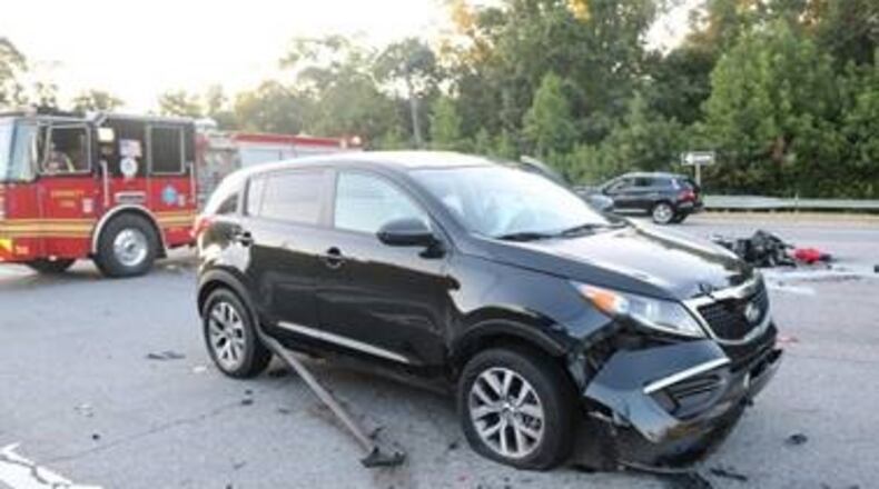 A Lawrenceville woman has been charged in connection with a wreck that killed a motorcyclist two weeks ago, police said.