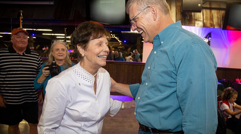 U.S. Rep. Barry Loudermilk and Carolyn Meadows, the president of the National Rifle Association, talk Friday during the fifth annual Marksmanship and BBQ Event at Adventure Outdoors in Smyrna. STEVE SCHAEFER / SPECIAL TO THE AJC
