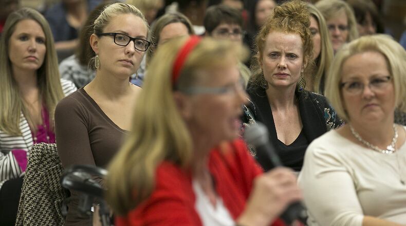 Special education teachers Alyssa Potasznik, left, from the Austin school district, and Emily Miller-Pena, right, from the Lago Vista district, listen intently to Judy Wells, foreground in red, during a 2016 meeting about special education in Texas. A large crowd gathered at the Region 13 Education Service Center in East Austin to voice their displeasure with Texas special education services to a listening board of representatives from the U.S. Department of Education and the Texas Education Agency. RALPH BARRERA / AMERICAN-STATESMAN