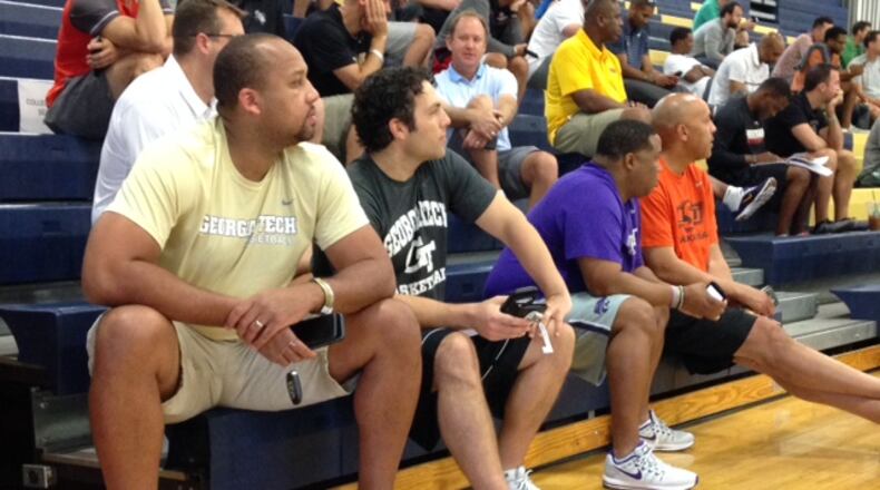 Georgia Tech coach Josh Pastner (second from left) and assistant coach Tavaras Hardy watch an AAU game at Spring Valley High in Las Vegas Thursday. (AJC photo by Ken Sugiura)
