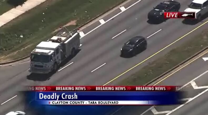 Two people waiting at a MARTA bus stop were hit when the impact of a collision sent a motorcycle into the stop, Clayton County police said.