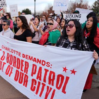 People protest against federal immigration enforcement Saturday, Nov. 15, 2025, in Charlotte, N.C. (AP Photo/Erik Verduzco)