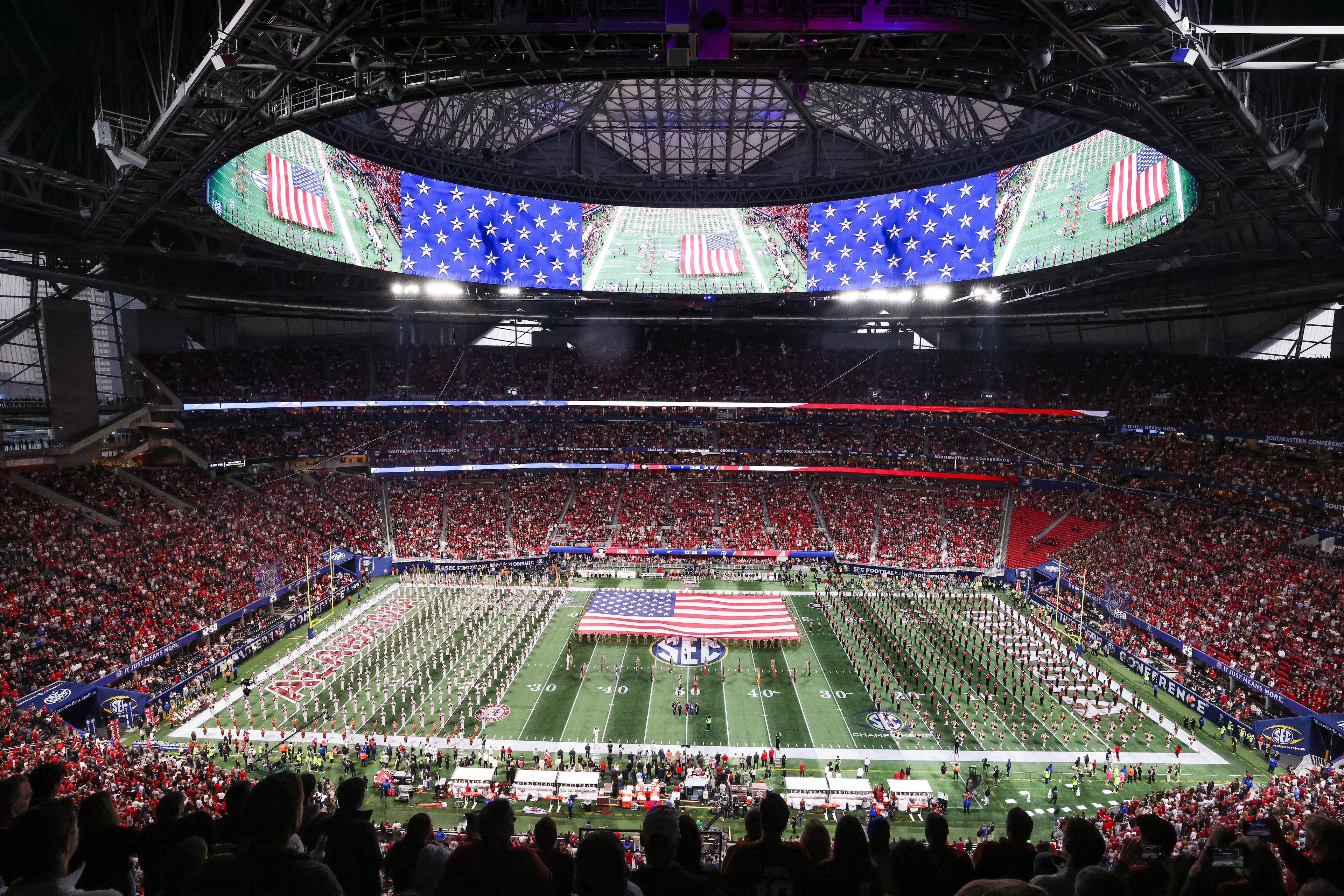The Georgia and Alabama marching bands perform during the national anthem at the SEC Championship Game at Mercedes-Benz Stadium, Saturday, Dec. 6, 2025, in Atlanta. (Jason Getz / AJC)
