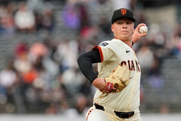 San Francisco Giants' Kyle Harrison pitches to a San Diego Padres batter during the first inning of a baseball game Wednesday, June 4, 2025, in San Francisco. (AP Photo/Godofredo A. Vásquez)